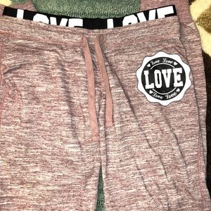 Pink sweatpants.